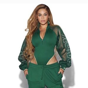 Ivy Park x Adidas green mesh sleeve bodysuit. Size XS. NWT.